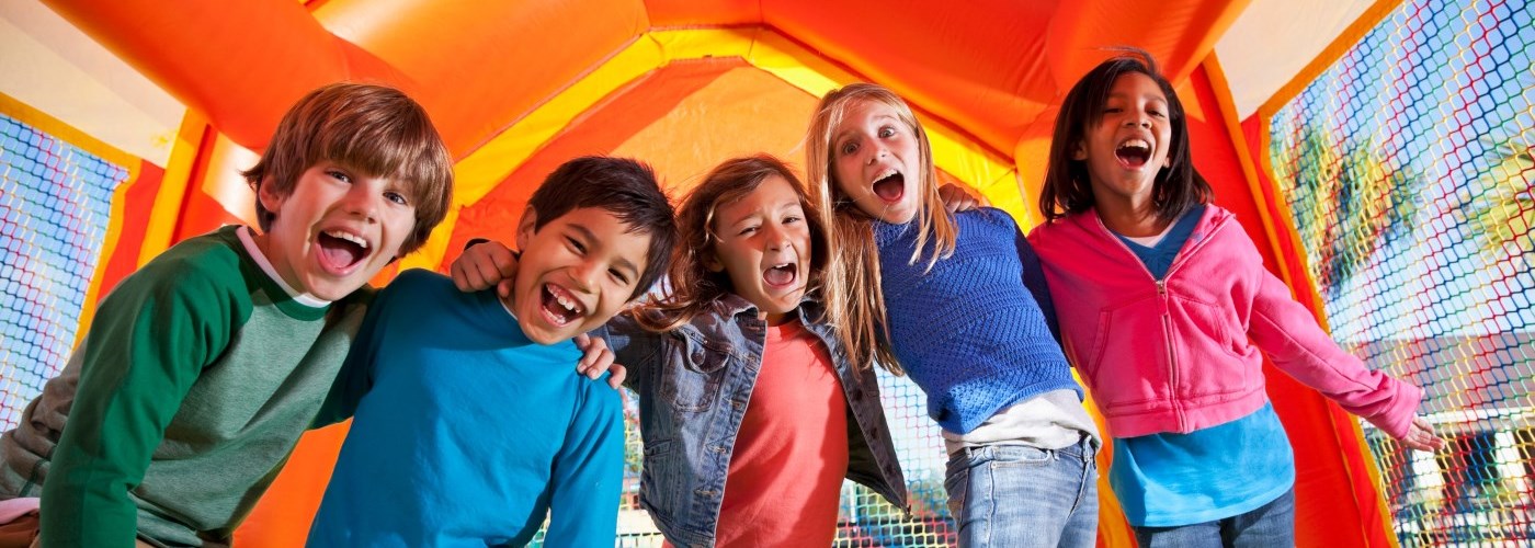 kids in an inflatable bouncy castle