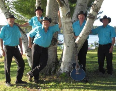 group of men in blue shirts and black cowboy hats