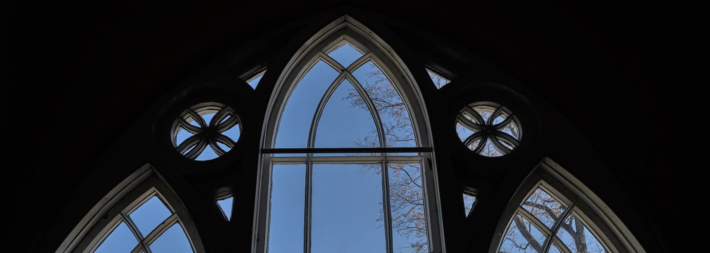 sky through silhouetted gothic window